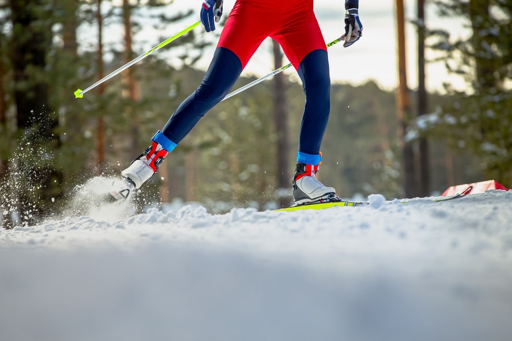 A view of a skier skiing in snow