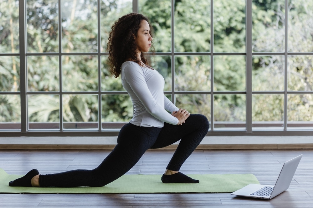 A view of a woman doing lunges