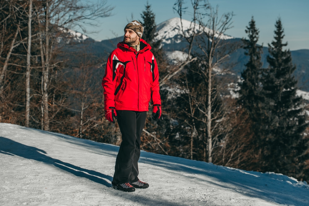 A Man In A Red Ski Jacket On The Background