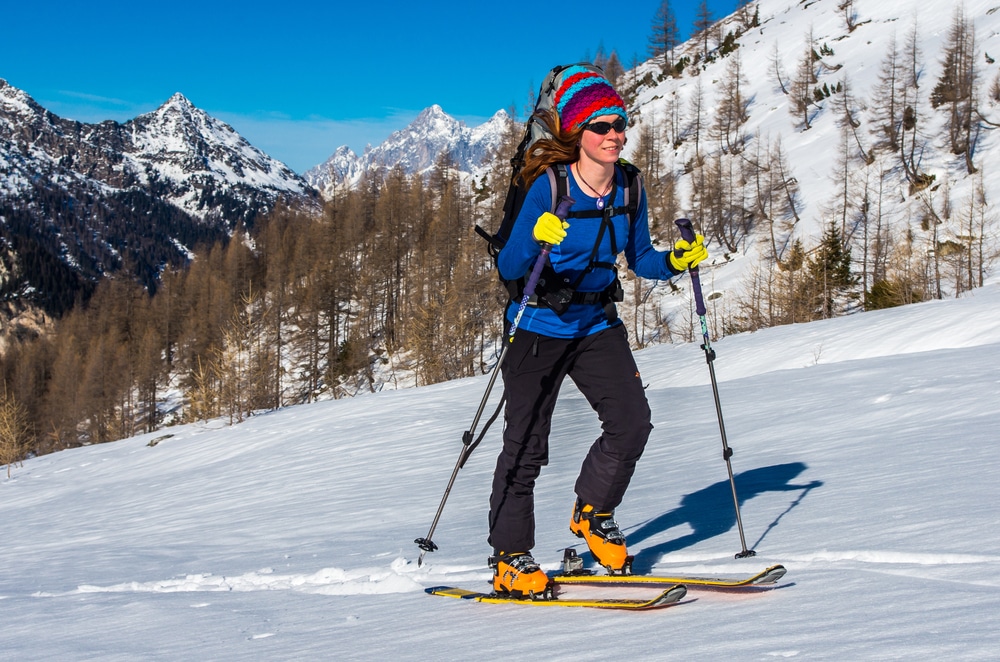 Girl Ski Touring In Mountains