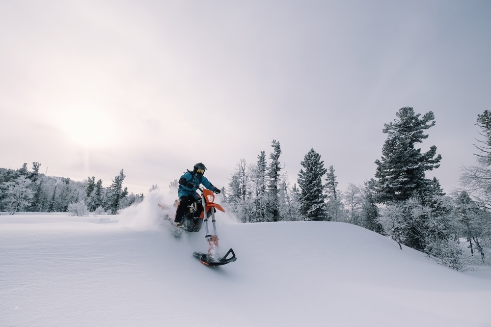 Snowbike Rider In Mountain Valley In Beautiful Snow Powder Modify