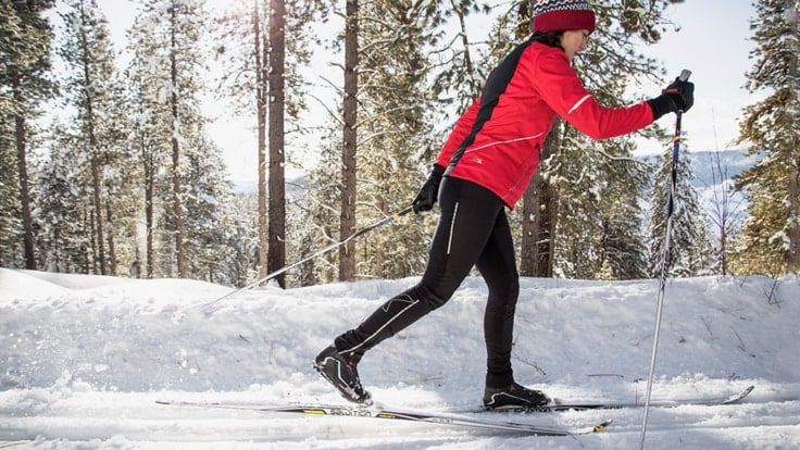 a lady doing cross country skiing