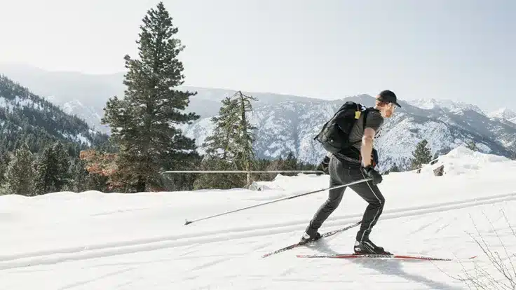 a man skating on snow