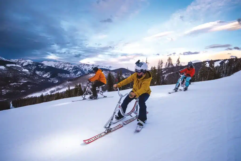 people on their ski bikes and enjoying the ride