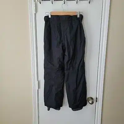 ski pants hanging at the back of the door