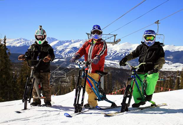 three riders on their ski bikes