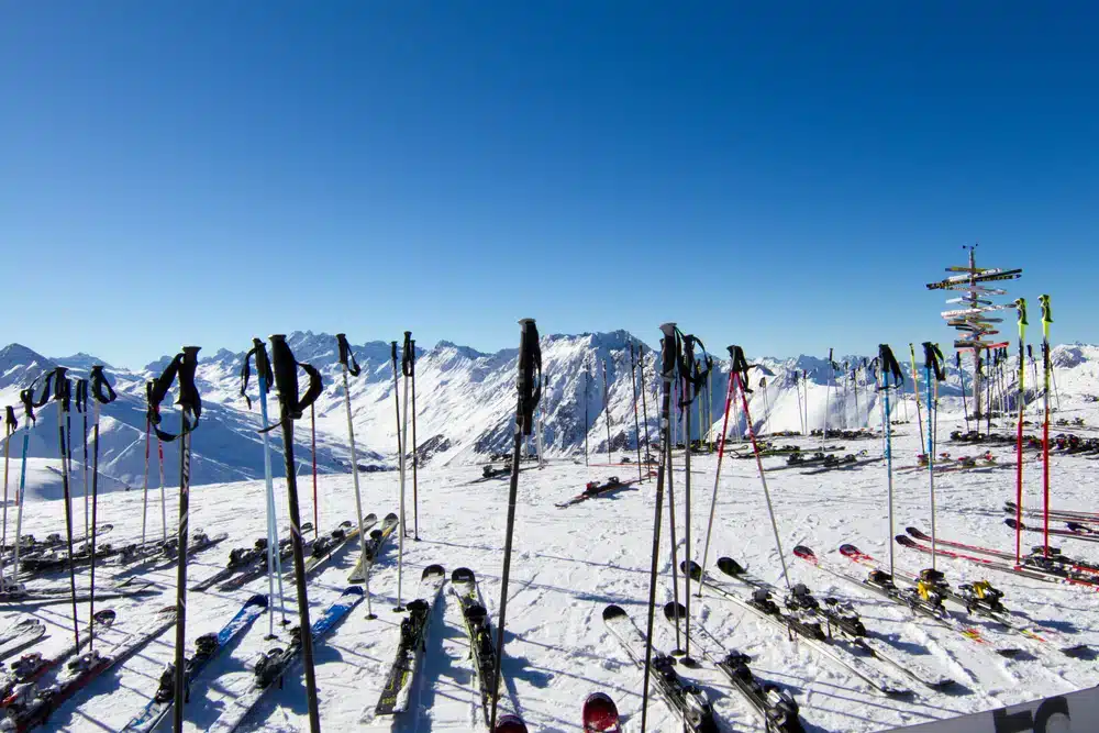 Scattered skis and ski poles at ski resort