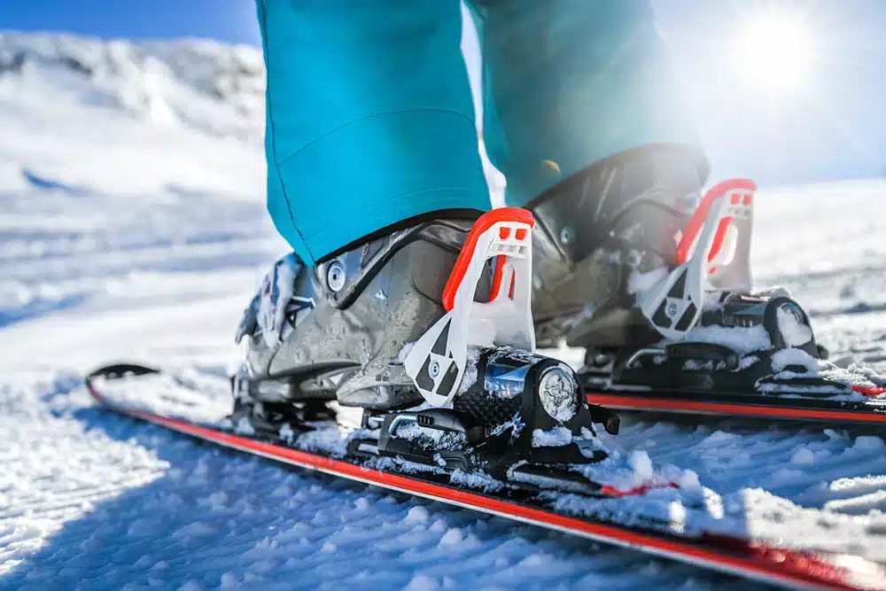 Winter skis and boots detailed view of the ski bindings concept in sunny day