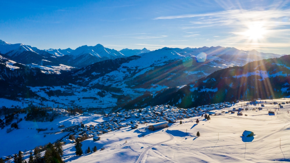 Aerial View Of Townwith Snow Covered Roofs Village In Switzerland