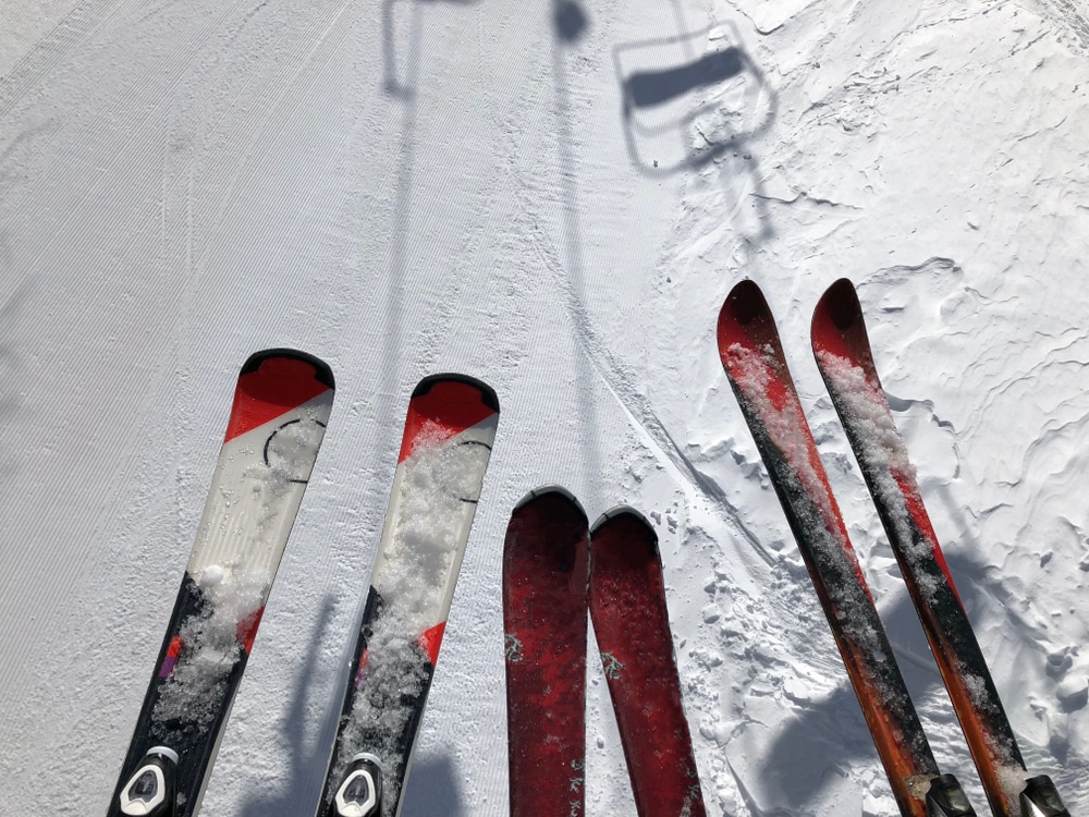 Picture Of Three Pairs Of Skis Of Skiers Family On