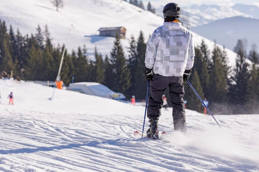 Backview of a person skiing Backview of a person skiing